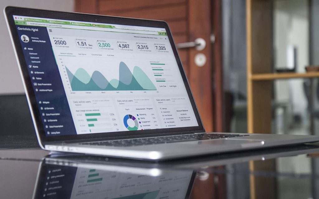 Photo of a laptop open with analytics on the screen